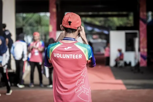 Volunteers teaching children in a classroom